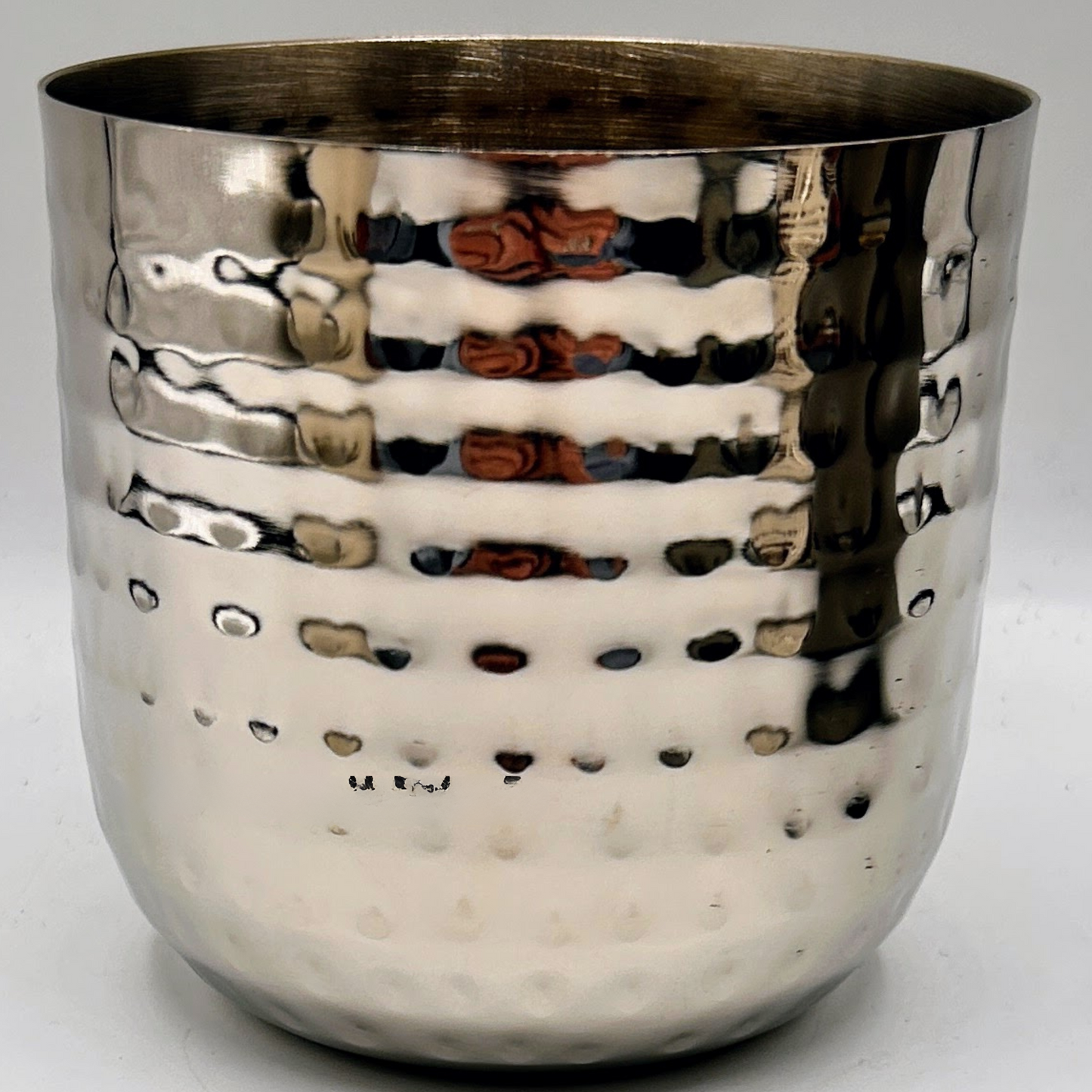 dimpled silver candle vessel