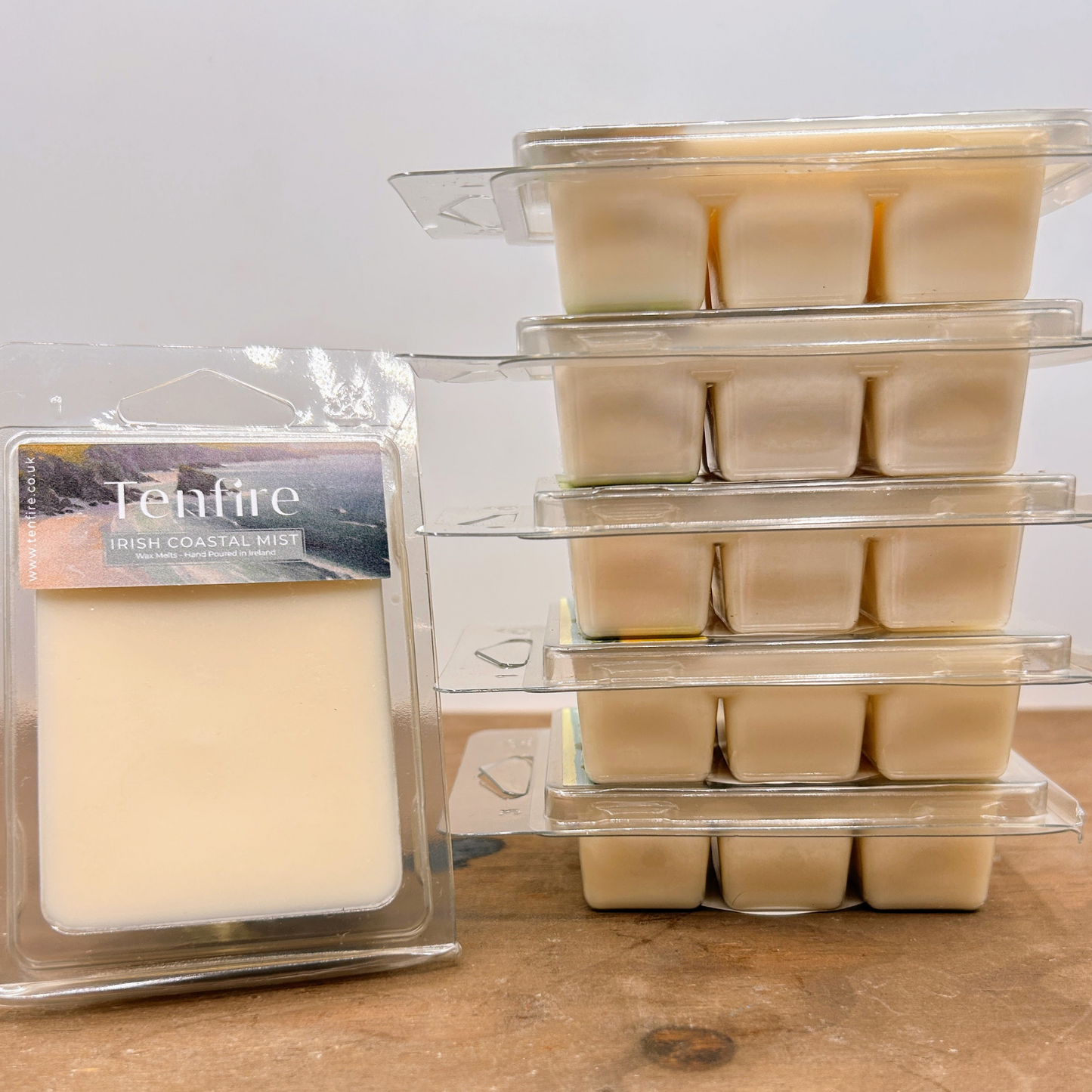 six filled wax melt clamshells stacked