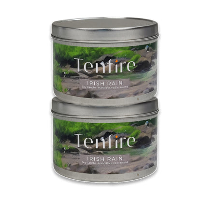 Two Tenfire Irish Rain candles in metal tins on a white background