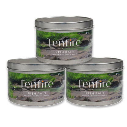 Three Tenfire Irish Rain candles in metal tins on a white background