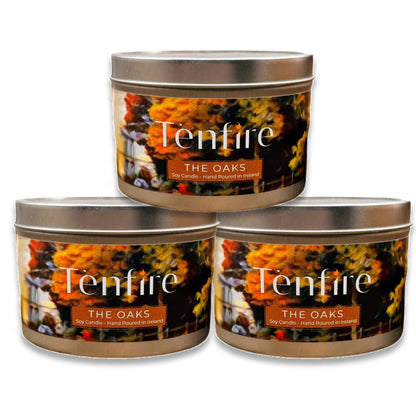 Three 'Tenfire The Oaks' candles in metal tins on a white background