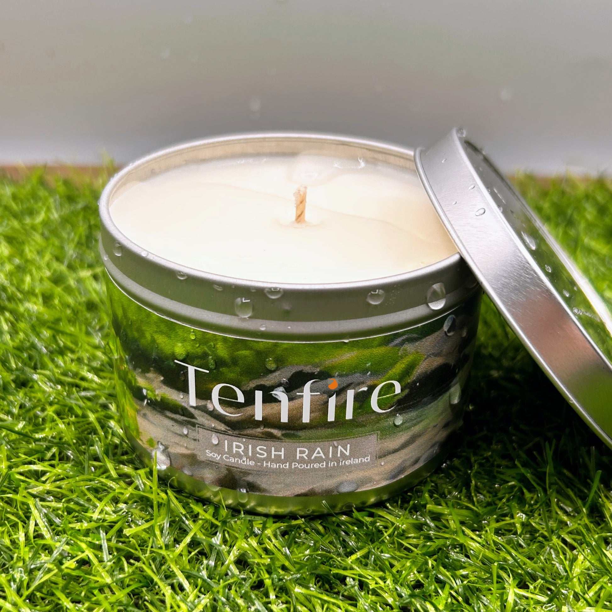 Tenfire candle in a tin on grass
