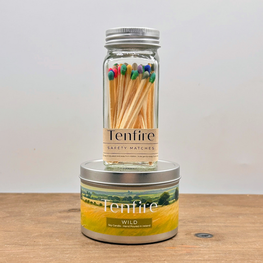 candle tin and glass jar of multicoloured matches