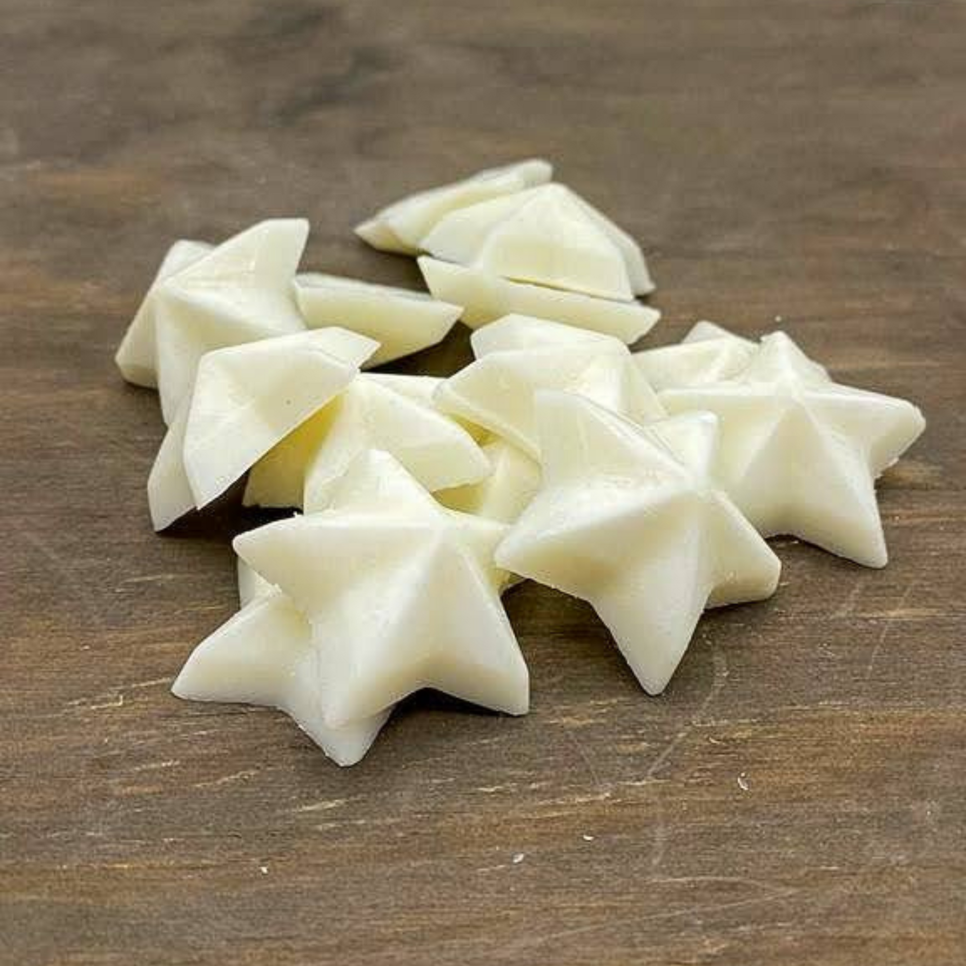 star shaped wax melts sitting on wood